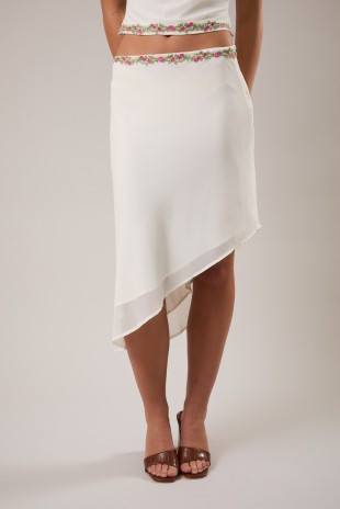 white uneven hem skirt with embroidered trim
