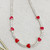 Crystal necklace with enamel hearts