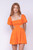 Orange mini dress with puff sleeves and side cutouts