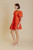 terracotta assymetrical hem dress with pleat hem and bubble sleeves