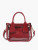 Clear crossbody bag with red crossbody strap, top handles, and coordinating insert bag