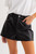 Black faux leather shorts with silver studs