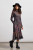 Black and purple plaid long sleeve turtleneck midi length dress