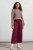 Burgundy wide leg crop jean with exposed buttons