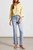 Light wash micro flare jean with exposed buttons