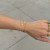 Dainty gold cross bracelet