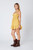 Mustard yellow dress with ruched bustier and open back