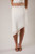 white uneven hem skirt with embroidered trim