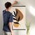 Enhanced Matte Paper Poster With Hanger 001. Black Frame, 24inx36in (60.96cmx 91.44cm), Front View. Picture shows boho style drawing design with two brownish, irregular surface, geometric objects in the background and six leaf black branch in the foreground. Great Gift for Family, Friends, Coworkers, Self, and Others.