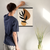 Enhanced Matte Paper Poster With Hanger 001. Black Frame, 16in x 20in (40.64cm x 50.80cm), Front View. Picture shows boho style drawing design with two brownish, irregular surface, geometric objects in the background and six leaf black branch in the foreground. Great Gift for Family, Friends, Coworkers, Self, and Others.