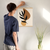 Enhanced Matte Paper Poster With Hanger 001. Oak Frame 16in x 20in (40.64cm x 50.80cm), Front View. Picture shows boho style drawing design with two brownish, irregular surface, geometric objects in the background and six leaf black branch in the foreground. Great Gift for Family, Friends, Coworkers, Self, and Others.