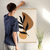 Enhanced Matte Paper Poster With Hanger 001. Oak Frame 24in x 36in (60.96cm x 91.44cm), Front View. Picture shows boho style drawing design with two brownish, irregular surface, geometric objects in the background and six leaf black branch in the foreground. Great Gift for Family, Friends, Coworkers, Self, and Others.