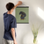 Enhanced Matte Paper Poster With Hanger 003. Black Frame, 16in x 20in (40.64cm x 50.80cm), Front View. Picture shows drawing of puppy with large Beagle style eyes. Great Gift for Family, Friends, Coworkers, Self, and Others.