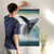 Enhanced Matte Paper Poster With Hanger 006. Black Frame, 24inx36in (60.96cmx 91.44cm), Front View. Picture shows fantastical scene of whale breaching above clouds, not water. Great Gift for Family, Friends, Coworkers, Self, and Others.