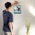Enhanced Matte Paper Poster With Hanger 006. White Frame 11in x 14in (27.94cm x 35.56cm), Front View. Picture shows fantastical scene of whale breaching above clouds, not water. Great Gift for Family, Friends, Coworkers, Self, and Others.