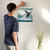 Enhanced Matte Paper Poster With Hanger 006. White Frame 16in x 16in (40.64cm x 40.64cm), Front View. Picture shows fantastical scene of whale breaching above clouds, not water. Great Gift for Family, Friends, Coworkers, Self, and Others.