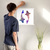 Enhanced Matte Paper Poster With Hanger 007. White Frame 18in x 18in (45.72cm x 45.72cm), Front View. Picture shows two colorful fish swimming side by side in opposite directions. Great Gift for Family, Friends, Coworkers, Self, and Others.
