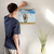 Enhanced Matte Paper Poster With Hanger 008. Oak Frame 16in x 16in (40.64cm x 40.64cm), Front View. Picture shows elephant mom and calf in short grass. Sky is blue with puffy white clouds. Great Gift for Family, Friends, Coworkers, Self, and Others.