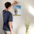 Enhanced Matte Paper Poster With Hanger 008. White Frame 12in x 18in (30.48cm x 45.72cm), Front View. Picture shows elephant mom and calf in short grass. Sky is blue with puffy white clouds. Great Gift for Family, Friends, Coworkers, Self, and Others.