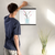 Enhanced Matte Paper Poster With Hanger 011. Black Frame, 16in x 16in (40.64cm x 40.64cm), Front View. Picture shows drawing of water in glass vase with branches sprouting colorful pink and yellow flower buds. Great Gift for Family, Friends, Coworkers, Self, and Others.