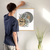 Enhanced Matte Paper Poster With Hanger 014. Oak Frame 18in x 24in (45.72cm x 60.96cm), Front View. Picture shows boho line drawing of a branch with a number of black leaves in the foreground and four non-concentric, large, solid-colored circles in the background. Great Gift for Family, Friends, Coworkers, Self, and Others.