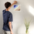 Enhanced Matte Paper Poster With Hanger 015. White Frame 10in x 10in (25.40cm x 25.40cm), Front View. Picture shows drawing of a beach as if looking from the sky. The top left corner shows dark blue and a whale swimming, with two lighters shades of blue blending into five shades or brown moving toward the lower right corner. Great Gift for Family, Friends, Coworkers, Self, and Others.