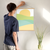 Enhanced Matte Paper Poster With Hanger 016. Oak Frame 18in x 24in (45.72cm x 60.96cm), Front View. Picture shows boho style drawing representing a sunset over hill-like shapes of green, blue, and orange. Great Gift for Family, Friends, Coworkers, Self, and Others.