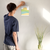 Enhanced Matte Paper Poster With Hanger 016. White Frame 8in x 10in (20.32cm x 25.40cm), Front View. Picture shows boho style drawing representing a sunset over hill-like shapes of green, blue, and orange. Great Gift for Family, Friends, Coworkers, Self, and Others.