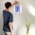 Enhanced Matte Paper Poster With Hanger 019. White Frame 12in x 12in (30.48cm x 30.48cm), Front View. Picture shows boho design art drawing of peacock style birds with colorful abstract feathers earrings. Great Gift for Family, Friends, Coworkers, Self, and Others.