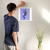 Enhanced Matte Paper Poster With Hanger 019. White Frame 14in x 14in (35.56cm x 35.56cm), Front View. Picture shows boho design art drawing of peacock style birds with colorful abstract feathers earrings. Great Gift for Family, Friends, Coworkers, Self, and Others.
