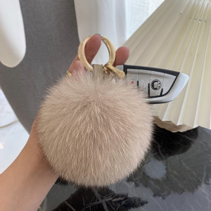 Elevate your style with our fox fur ball keychain. Crafted from luxurious fox fur, this keychain adds a touch of elegance to your accessories. Soft, fluffy, and versatile, it's the perfect fashion statement or thoughtful gift. Explore our collection and embrace the plush beauty of fox fur.