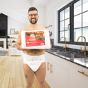 Active Air Incontinence Briefs on male model holding bag of Active Air.