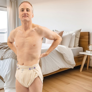 Organic Nighttime Prefold Cloth Diaper on male model, front-view.