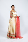 Adorned with vibrant floral and pearl embroidery, this lehenga set is a stunner. Paired with a blouse featuring see through net sleeves with embroidery, built in cups, and adjustable doris in the back. Comes with a peach net dupatta with pearl embroidery. Our skirts are stitched to fit sizes S-L through adjustable tie or elastic at the back. Please refer to the size guide.