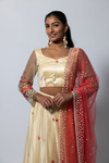 Adorned with vibrant floral and pearl embroidery, this lehenga set is a stunner. Paired with a blouse featuring see through net sleeves with embroidery, built in cups, and adjustable doris in the back. Comes with a peach net dupatta with pearl embroidery. Our skirts are stitched to fit sizes S-L through adjustable tie or elastic at the back. Please refer to the size guide.