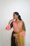 Flowy soft silk skirt embellished with pearl embroidery. Paired with a dusty pink blouse and soft net dupatta. Our skirts are stitched to fit sizes S-L through adjustable tie or elastic at the back. Please refer to the size guide.