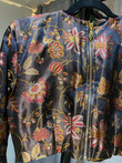 Intricately hand woven artisanal Banarasi silk blouse. Very soft and shiny fabric. Featuring long sleeves. Intricately hand woven artisanal Banarasi silk blouse. Very soft and shiny fabric. Featuring long sleeves.