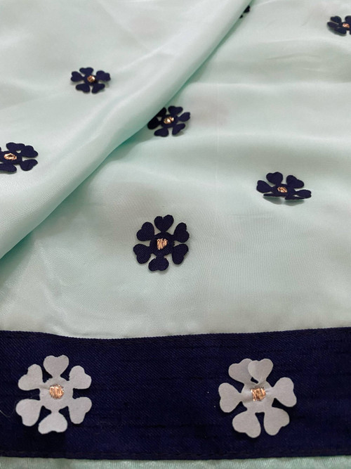 Soft Satin saree featuring patch work and cute borders. Comes with a fun ruffled sleeve blouse.