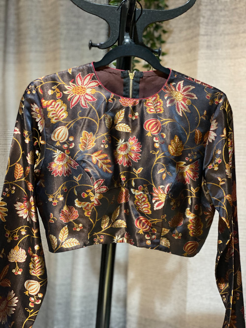 Intricately hand woven artisanal Banarasi silk blouse. Very soft and shiny fabric. Featuring long sleeves. Intricately hand woven artisanal Banarasi silk blouse. Very soft and shiny fabric. Featuring long sleeves.