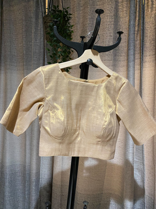 Designer Blouse featuring boat neck and elbow sleeves. Designer Blouse featuring boat neck and elbow sleeves.