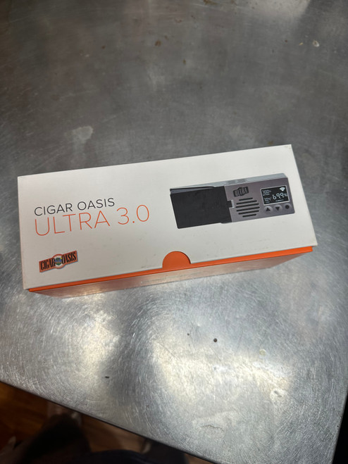 Designed for Desktop Humidors (appx. 50-150 cigars)

The Cigar Oasis Ultra 3.0 takes all the worry and fuss out of storing and maintaining your precious stogies. Its slim profile and lid-mounted design makes it the most attractive and efficient humidification solution for desktop humidors.

Pre-treated water cartridge requires distilled water only (appx 2-6 weeks for refiling)
Powered by a thin but durable electronic ribbon cable that fits through humidor seal
Large backlit display with live humidity & temperature readings
Soft to the touch sensor buttons to adjust your humidity setpoint
Built-in Wi-Fi capability for optional use with the Cigar Oasis SmartHumidor ™ IOS & Android app
Not suggested for use in climate controlled/wineador humidors
Supports internal humidor volume up to 1.5 cubic ft.
Dimensions: Length: 7” Width: 2.5” Height: 1”

SKU: HA3-3000