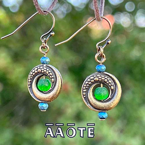 Interesting yet simple, lightweight earrings. Featuring scale and spiraling textured design on flattened circular metal donut beads adorned with recycled glass and glass crystal beading. Finished on plated brass, stainless steel, or copper earwires (nickel and lead-free) with rubber stoppers included. Interesting yet simple, lightweight earrings. Featuring scale and spiraling textured design on flattened circular metal donut beads adorned with recycled glass and glass crystal beading. Finished on plated brass, stainless steel, or copper earwires (nickel and lead-free) with rubber stoppers included.