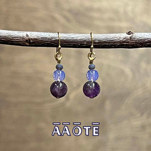 Designed and assembled here at AAOTE these gemstone earrings are lightweight, easy to wear, and feature gem, glass, and metal beading. Designed and assembled here at AAOTE these gemstone earrings are lightweight, easy to wear, and feature gem, glass, and metal beading.