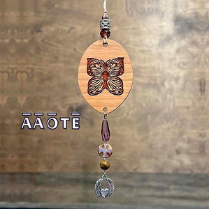 Our Beaded and Charmed Wood Diffusers are an AAOTE original design! They are a unique, beautiful, and natural way to diffuse essential oils in your home, office or car. Simply apply several drops of essential oil to one (or both) sides of the wood, and hang wherever you want to enjoy aromatherapy. They are finished with glass, metal, and gemstone beads with a charm or bell, as described.