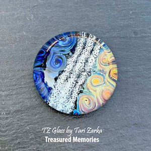 These stunning memorial paperweights allow you to encapsulate the precious memories of that special person or pet in your life that has passed away. Each is a sentimental and meaningful work of art that can be treasured for years and passed down for generations.
AAOTE's founder, Tari Zarka, works with love to encase and forever preserve the ashes that you provide into durable borosilicate glass, creating a timeless treasure. Please keep in mind that each piece will have it’s own truly unique charm because of the way they are made, one at a time in the flame. These stunning memorial paperweights allow you to encapsulate the precious memories of that special person or pet in your life that has passed away. Each is a sentimental and meaningful work of art that can be treasured for years and passed down for generations.
AAOTE's founder, Tari Zarka, works with love to encase and forever preserve the ashes that you provide into durable borosilicate glass, creating a timeless treasure. Please keep in mind that each piece will have it’s own truly unique charm because of the way they are made, one at a time in the flame.