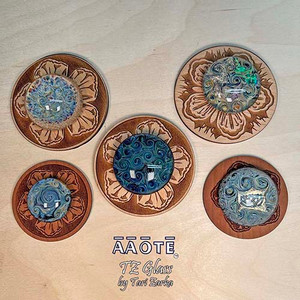 Flameworked glass art paperweights by AAOTE's founder, Tari Zarka. Totally one-of-a-kind, investment-quality glass art on a wooden trivet.
WIT-TZG-304 is a Rainbow Whirling Skies design on a wood trivet. It's approximately 1.75" in diameter on a 1/8"H engraved wooden trivet.
WIT-TZG-305 is a Deep Waters Whirling Skies design on a wood trivet. It's approximately 1.75" in diameter on a 1/8"H engraved wooden trivet.
WIT-TZG-306 is a Dichroic Whirling Skies design on a wood trivet. It's approximately 1.75" in diameter on a 1/8"H engraved wooden trivet.
WIT-TZG-307 is a Dichroic Lotus Whirling Skies design on a wood trivet. It's approximately 1.6" in diameter on a 1/8"H engraved wooden trivet.
WIT-TZG-308 is a Spiraling Skies design on a wood trivet. It's approximately 1.25" in diameter on a 1/8"H engraved wooden trivet.
There is only one of each available. The piece you see is the piece you get. Each is etched with a TZ, the artist's initials, on the underside of the weight. Flameworked glass art paperweights by AAOTE's founder, Tari Zarka. Totally one-of-a-kind, investment-quality glass art on a wooden trivet.
WIT-TZG-304 is a Rainbow Whirling Skies design on a wood trivet. It's approximately 1.75" in diameter on a 1/8"H engraved wooden trivet.
WIT-TZG-305 is a Deep Waters Whirling Skies design on a wood trivet. It's approximately 1.75" in diameter on a 1/8"H engraved wooden trivet.
WIT-TZG-306 is a Dichroic Whirling Skies design on a wood trivet. It's approximately 1.75" in diameter on a 1/8"H engraved wooden trivet.
WIT-TZG-307 is a Dichroic Lotus Whirling Skies design on a wood trivet. It's approximately 1.6" in diameter on a 1/8"H engraved wooden trivet.
WIT-TZG-308 is a Spiraling Skies design on a wood trivet. It's approximately 1.25" in diameter on a 1/8"H engraved wooden trivet.
There is only one of each available. The piece you see is the piece you get. Each is etched with a TZ, the artist's initials, on the underside of the weight.