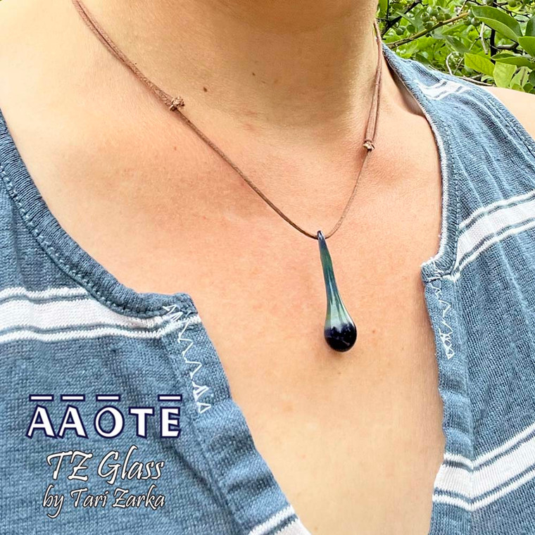 AAOTE's founder Tari Zarka flameworks these delicate, lightweight glass Drop of Positivity Necklaces by hand to remind us to be mindful to harness the power of positivity.

To move guided with light and love, especially when we're having our own difficult times, are confused, scared, or angry, etc.. is a gorgeous level of mindfulness at life, powered and stabilized by positive vibes.  These are a $20 handmade glass art, metal-free, minimalistic jewelry, unisex gifting idea.