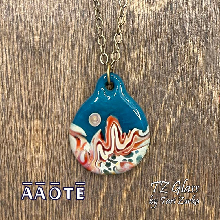 In this wearable, flameworked TZ Glass art collection Tari seeks to relay the rich colors, wind and water chisled rock of our Western United States desert areas. The desert is an amazing place teeming with the potential to allow us to expand our horizons.