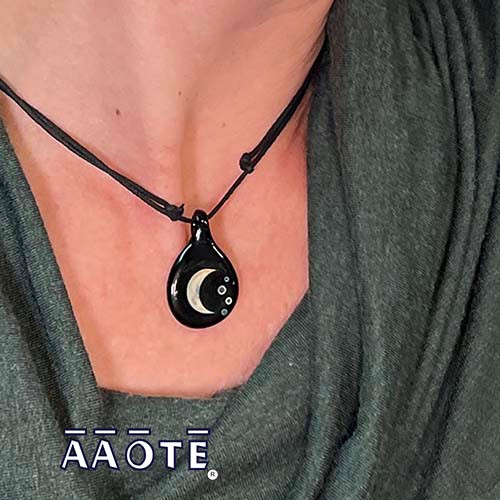We can't always get out to see a perfect moonscape but with these exquisitely handmade glass art interpretations we can keep close stellar moon vibes wherever we roam. 

Available in three options:

Waxing Crescent Moon with Stars (waxing moon is a backwards 'c'). 

Waning Crescent Moon with Stars (waning moon is a 'C' facing correctly).

Full Moon.

These are made to be a slightly smaller option to our Full Moon Crescent Moon double sided pendant and coordinate great with the Moon Phases Earrings.

Each glass pendant piece is just under 1" long, finished on a sliding knot cotton black cording. Please check out this link if you'd like to upgrade to a chain finishing.