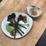 Charred Broccolini Tossed in Chromatic Sultana & Shallot Vinaigrette on Coconut Chive Cream Sauce w/Toasted Pine nut Sudden Coffee Duqqa